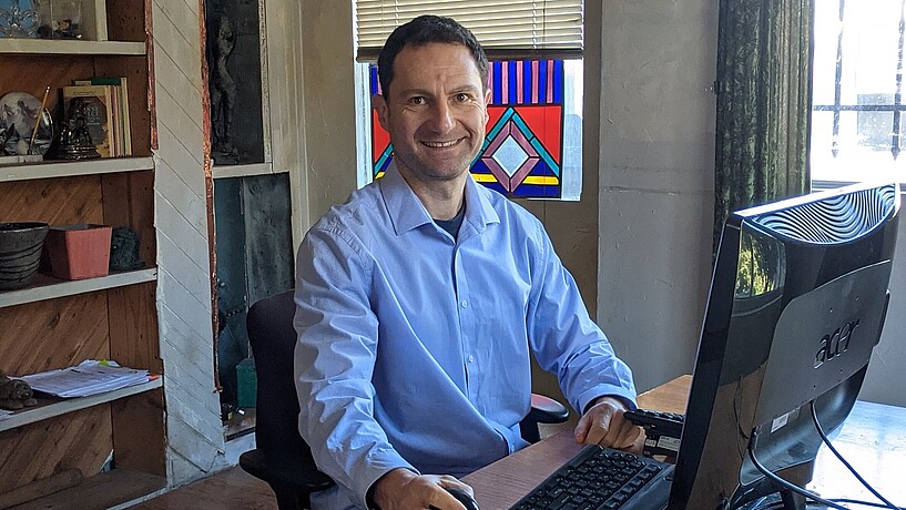 Man at desk with computer