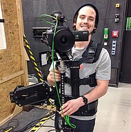 
                                Student with film camera
                            