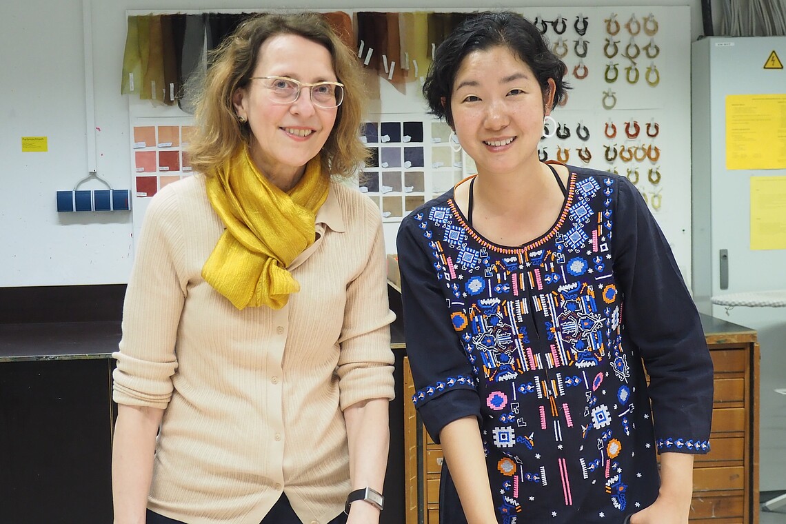Two female professors looking into the camera