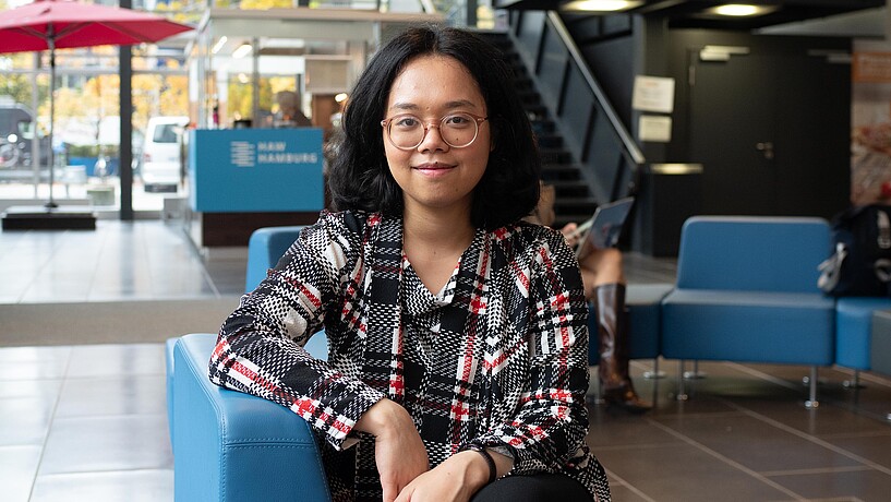 Female student sitting in university building