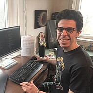 
                                Male student in front of a computer
                            