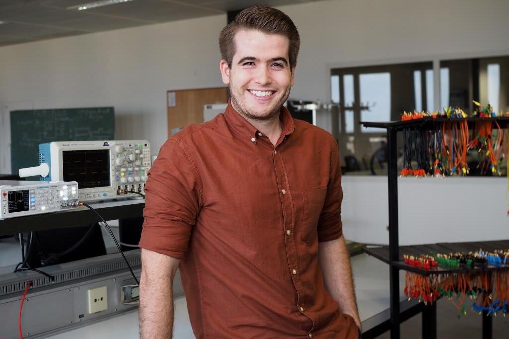 Male student sitting in computer lab